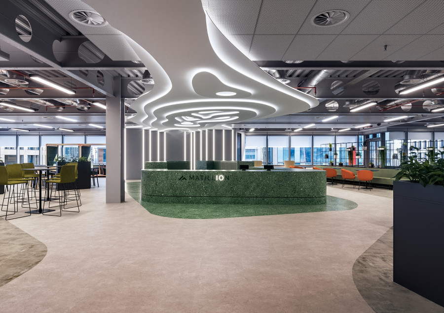 3D visualization of the Matillion Manchester office lobby with modern ceiling lighting and open workspace design