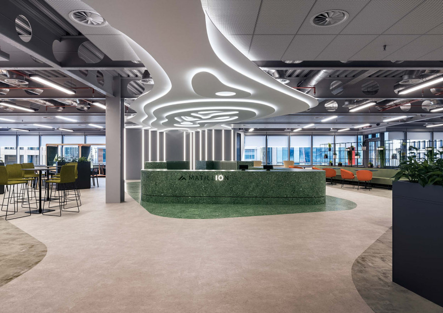 3D visualization of the Matillion Manchester office lobby with modern ceiling lighting and open workspace design