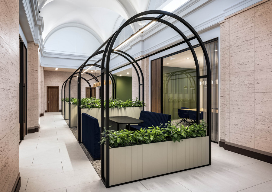 Internal garden pods — Visualization of semi-private seating pods framed in black metal and surrounded by greenery, designed for informal meetings.