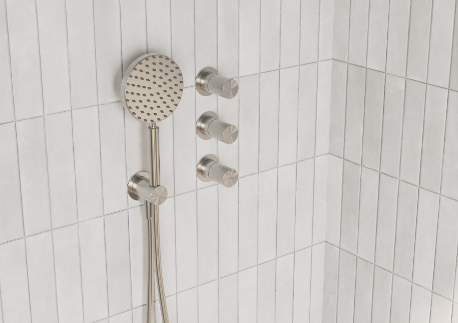 Bathroom shower system product CGI with rainfall head, handheld shower, and control fittings